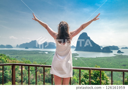 woman enjoy Phang Nga Bay view from viewpoint at day, Thailand, famous travel destination vacation in tropical country 126161959
