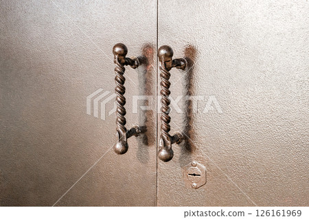 handles on metal painted gates close-up handles on metal painted gates close-up 126161969