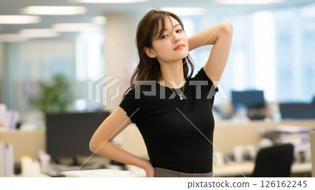 Young businesswoman posing at her desk 126162245