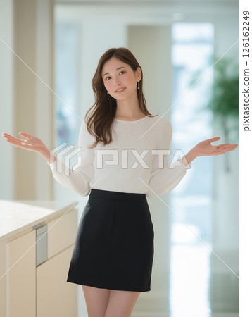 Confused businesswoman with arms outstretched 126162249
