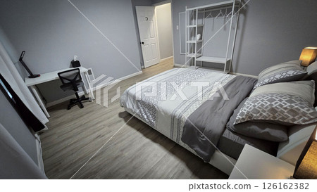 Modern bedroom interior featuring minimalist neutral decor, clean lines, wooden flooring, and soft bedding. The room exudes a cozy, inviting atmosphere for relaxation and comfort Modern bedroom interior featuring minimalist neutral decor, clean lines, wooden flooring, and soft bedding. The room exudes a cozy, inviting atmosphere for relaxation and comfort 126162382