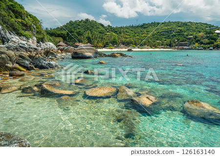 Summer vacation landscape of a bay and clear blue beach with rocks and corals on Koh Tao. Summer vacation landscape of a bay and clear blue beach with rocks and corals on Koh Tao. 126163140