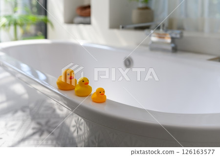 Duck doll in the bathroom 126163577