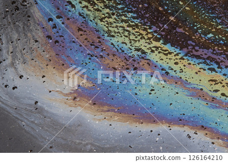 Oil slick on the asphalt road background. Stylish background image. Oil slick on the asphalt road background. Stylish background image. 126164210