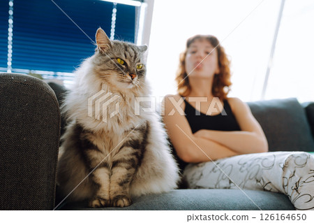 young woman spending time with her cat young woman spending time with her cat 126164650