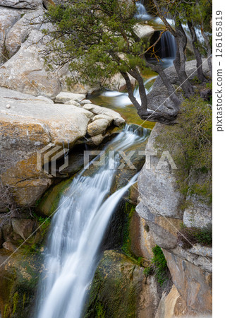 Beautiful creek with waterfalls in Spain in Catalonia, near the small village Rupit. Creek Rupit. Beautiful creek with waterfalls in Spain in Catalonia, near the small village Rupit. Creek Rupit. 126165819