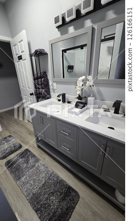 Modern Bathroom Interior Design, Clean and simple bathroom interior showcasing a functional bathtub, modern sink, and neatly arranged amenities for a refreshing and inviting atmosphere 126166151