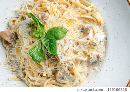 Portion of alfredo pasta with mushrooms Portion of alfredo pasta with mushrooms 126166818