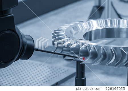 The multi axis CMM machine measure the gas turbine engine parts in the light blue scene. 126166955