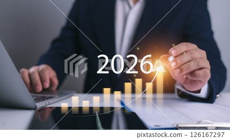 Growth Target 2026, Businessman analyzes arrow chart increasing business growth, Vision for 2026, Opportunity and strategy planning, Revenue, Profit, Global economic outlook, New business plan setting 126167297