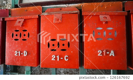 traditional local Hong Kong metal hand painted red mail box with numbers on it 126167692