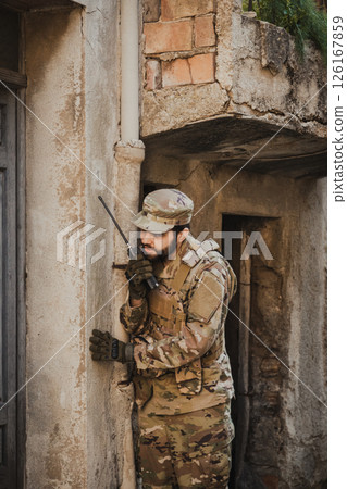 Soldier Communicates With Transceiver Before Entering In A House 126167859