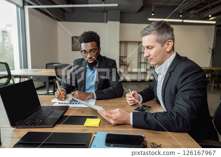 Business consultant talking to the client and looking involved 126167967