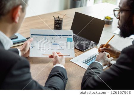 Business consultant talking to the client and looking involved 126167968