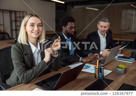 Lawyers working together on the project and looking interested and involved 126167977