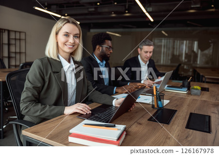 Lawyers working together on the project and looking interested and involved 126167978