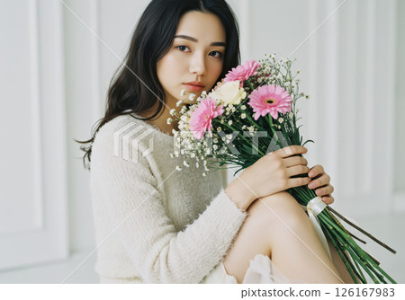 Natural portrait of a woman holding a bouquet of flowers (AI-generated image) 126167983
