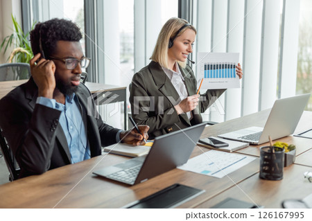 Business consultants having online call with the client and looking busy Business consultants having online call with the client and looking busy 126167995