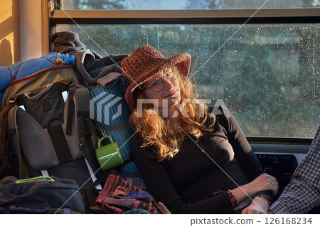 Young woman backpacking trip on a train journey 126168234