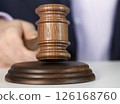 Auctioneer is hitting with gavel 126168760