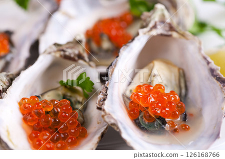 Raw oyster on white background Raw oyster on white background 126168766