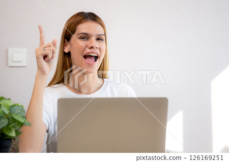 Happy young caucasian businesswoman video call for meeting in modern home office. 126169251