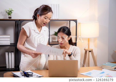 Two young asian businesswoman planning and strategy about marketing and financial. Two young asian businesswoman planning and strategy about marketing and financial. 126169279