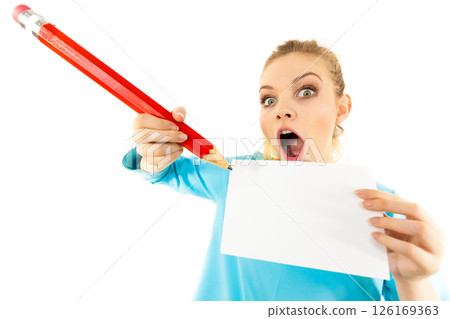 Woman with big pencil writing on paper 126169363