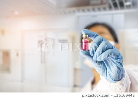 Doctor holding a vial of vaccine, concept of vaccination against epidemics 126169442