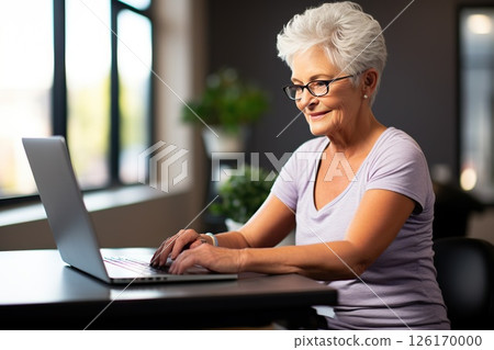 Silver Surfer Serenity Joyful Senior Woman Embraces Technology, Engaging with Laptop to Email Friends, Browse, and Share in Retirement Bliss. created with Generative AI Silver Surfer Serenity Joyful Senior Woman Embraces Technology, Engaging with Laptop to Email Friends, Browse, and Share in Retirement Bliss. created with Generative AI 126170000