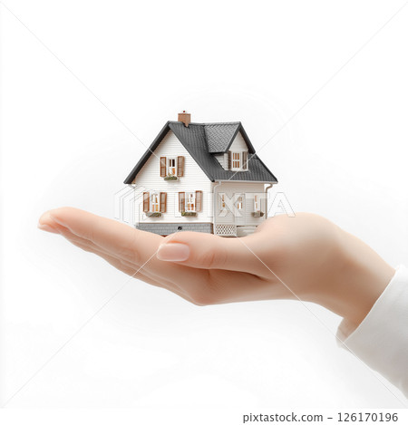 A model of a house in hand. Image material for planning your own home 126170196