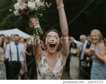 The bridesmaids catching the bride's bouquet is a joyful moment during the wedding celebration. The bridesmaids catching the bride's bouquet is a joyful moment during the wedding celebration. 126171717