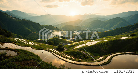 Golden Rice Terraces at Sunrise A sweeping aerial view of layered rice terraces bathed in the soft, early morning glow. 126172325