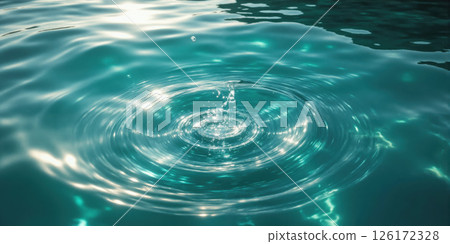 Water Surface with Swirl Clear, turquoise water swirls gently, creating a circular pattern, with sunlight reflecting off the surface, high-angle 126172328