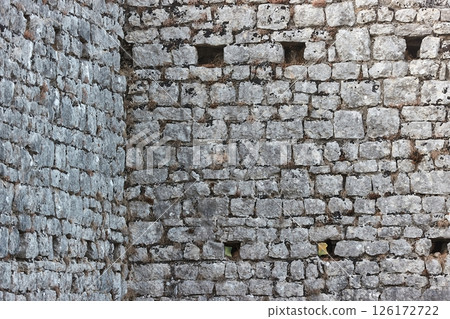 Old stone wall of a castle Old stone wall of a castle 126172722