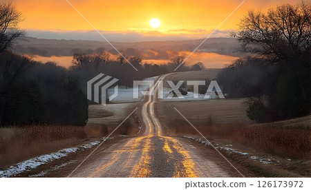 Golden hour illuminates a tranquil rural landscape with frosted fields 126173972