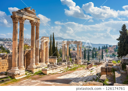 Sunny cityscape of athens, greece, featuring ancient ruins and standing columns 126174761