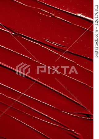 Vibrant red lipstick texture for beauty and cosmetic themes. Red lipstick background for beauty concept. Vibrant red lipstick texture for beauty and cosmetic themes. Red lipstick background for beauty concept. 126176812