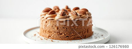 Delicious chocolate cake with nut topping ready to be served Delicious chocolate cake with nut topping ready to be served 126176980