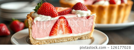 Delicious strawberry dessert with creamy filling on a plate during a sunny afternoon 126177028