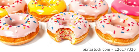 Colorful assorted donuts with sprinkles on a white background ideal for dessert lovers and party treats 126177326