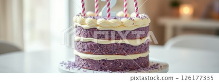 Colorful purple cake adorned with candles sits elegantly on a table, perfect for a celebration or special occasion 126177335