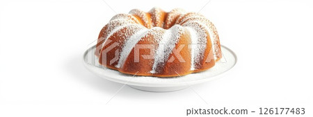 Sponge cake with powdered sugar served on a white plate for a sweet dessert experience 126177483