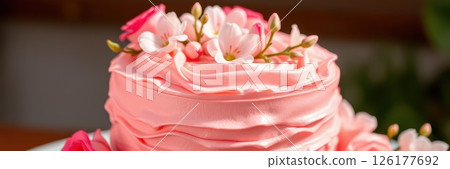 Delightful pink floral cake adorned with fresh blooms for a special celebration or gathering Delightful pink floral cake adorned with fresh blooms for a special celebration or gathering 126177692