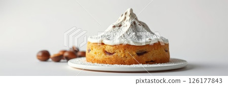 Delicious cake topped with meringue and decorated with confectioners sugar, perfect for any celebration or dessert table 126177843