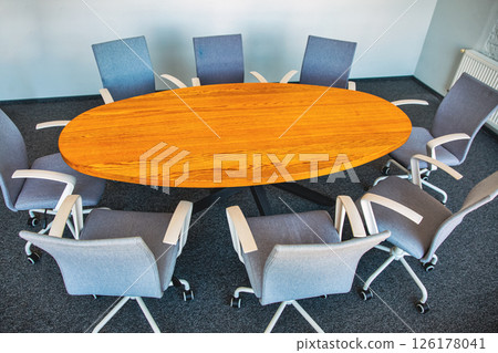 Modern empty meeting room with wooden table Modern empty meeting room with wooden table 126178041