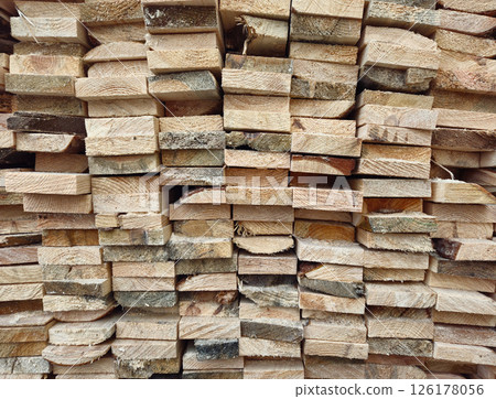 Stacked Wooden Logs Arranged in Neat Horizontal Alignment Close-Up Stacked Wooden Logs Arranged in Neat Horizontal Alignment Close-Up 126178056