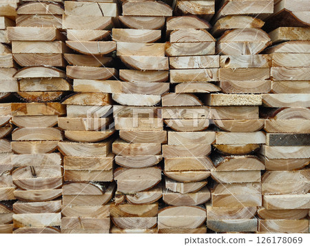 Stacked Wooden Logs Arranged in Neat Horizontal Alignment Close-Up Stacked Wooden Logs Arranged in Neat Horizontal Alignment Close-Up 126178069