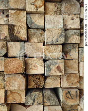 Stack of Wooden Planks in Construction Warehouse for Building Projects Stack of Wooden Planks in Construction Warehouse for Building Projects 126178071