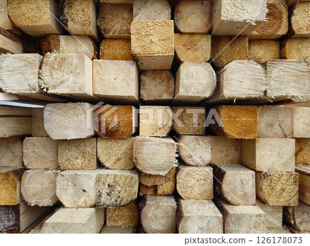 Stack of Wooden Planks in Construction Warehouse for Building Projects Stack of Wooden Planks in Construction Warehouse for Building Projects 126178073